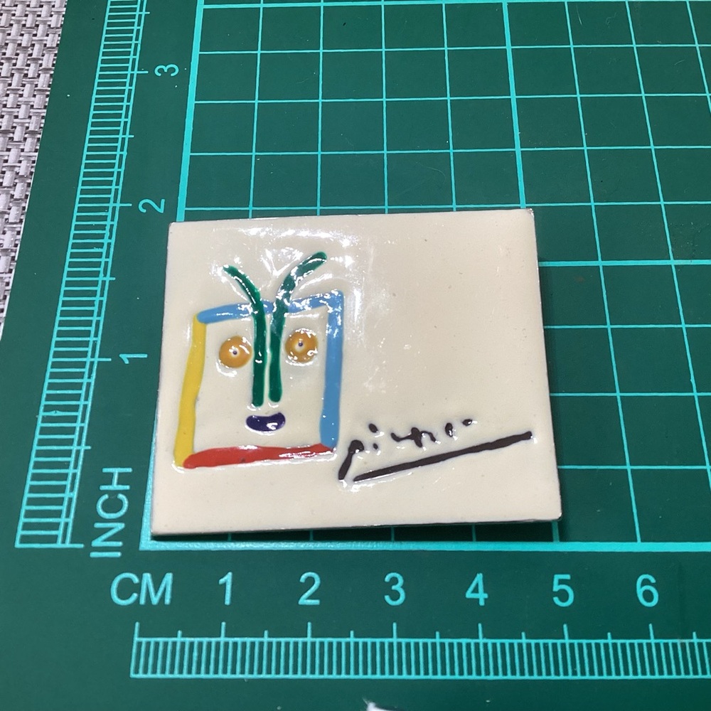 Picasso enameled metallic brooch